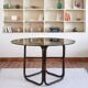 Round dining table in rattan, smoked glass top, 1970s.