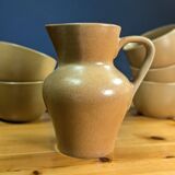 Jug and 5 cups in orange stoneware, very good condition, signed and numbered