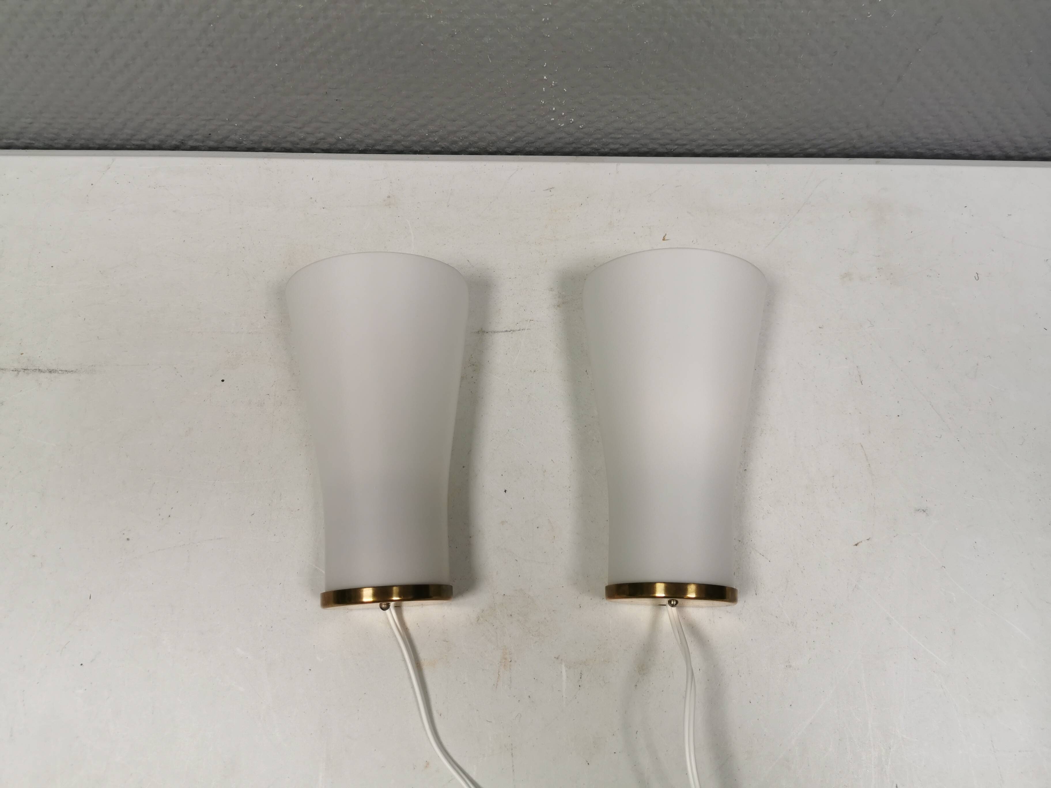 A set of retro wall lamps with white opal glass shades, Denmark 1950s