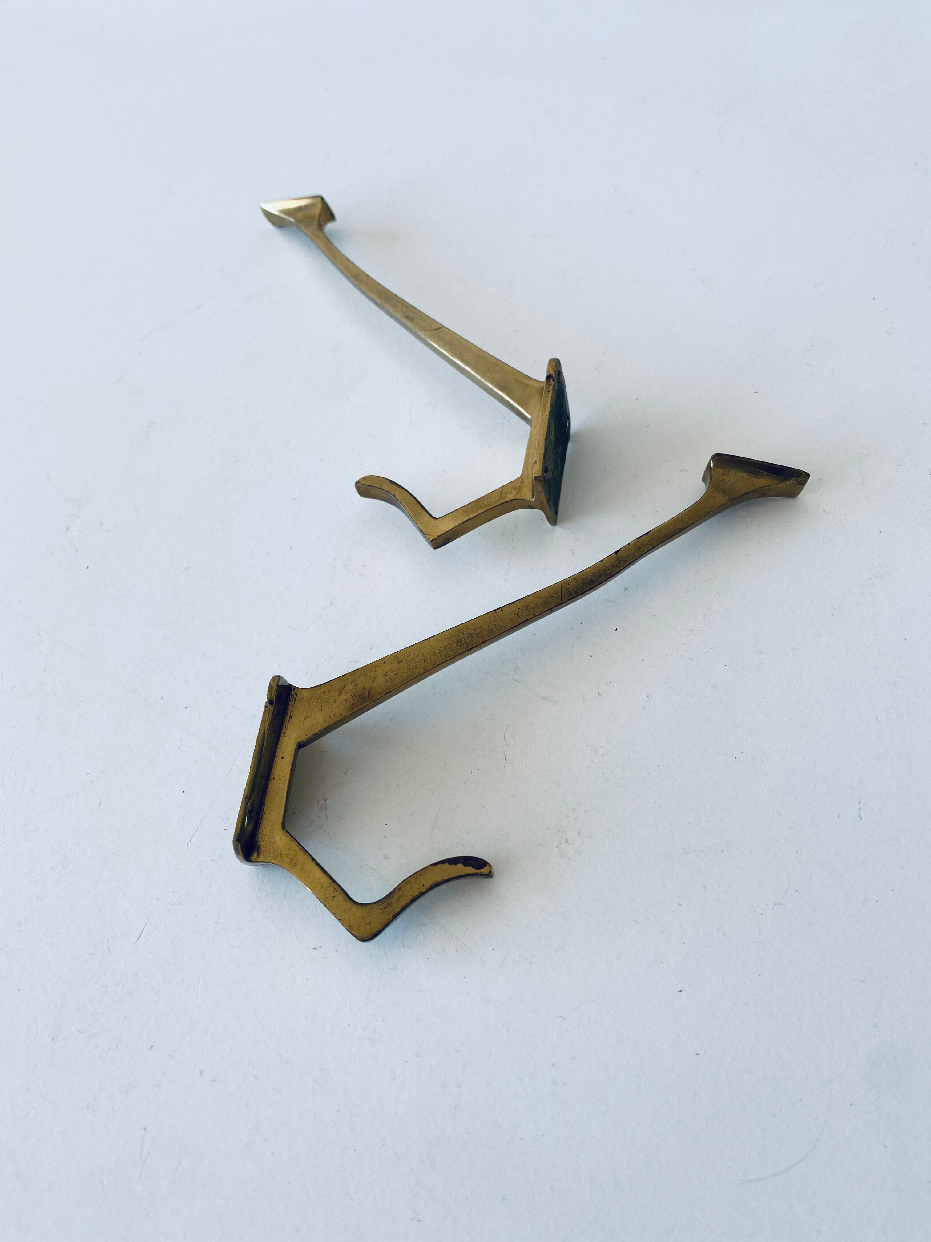 Pair of vintage brass hooks