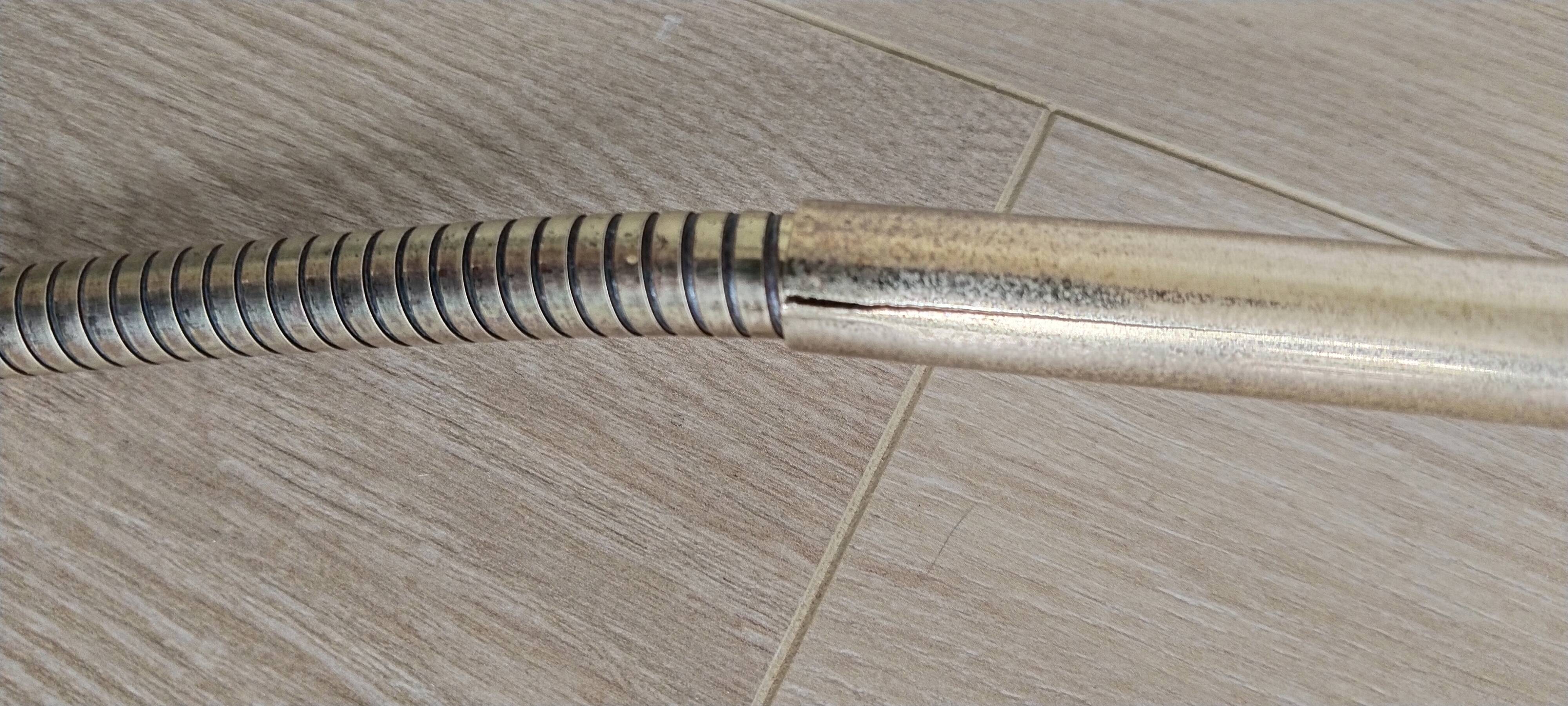 Green and gold articulated desk lamp