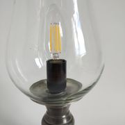 Vintage lamp consisting of a glass tulip-shaped fireplace and a pewter foot