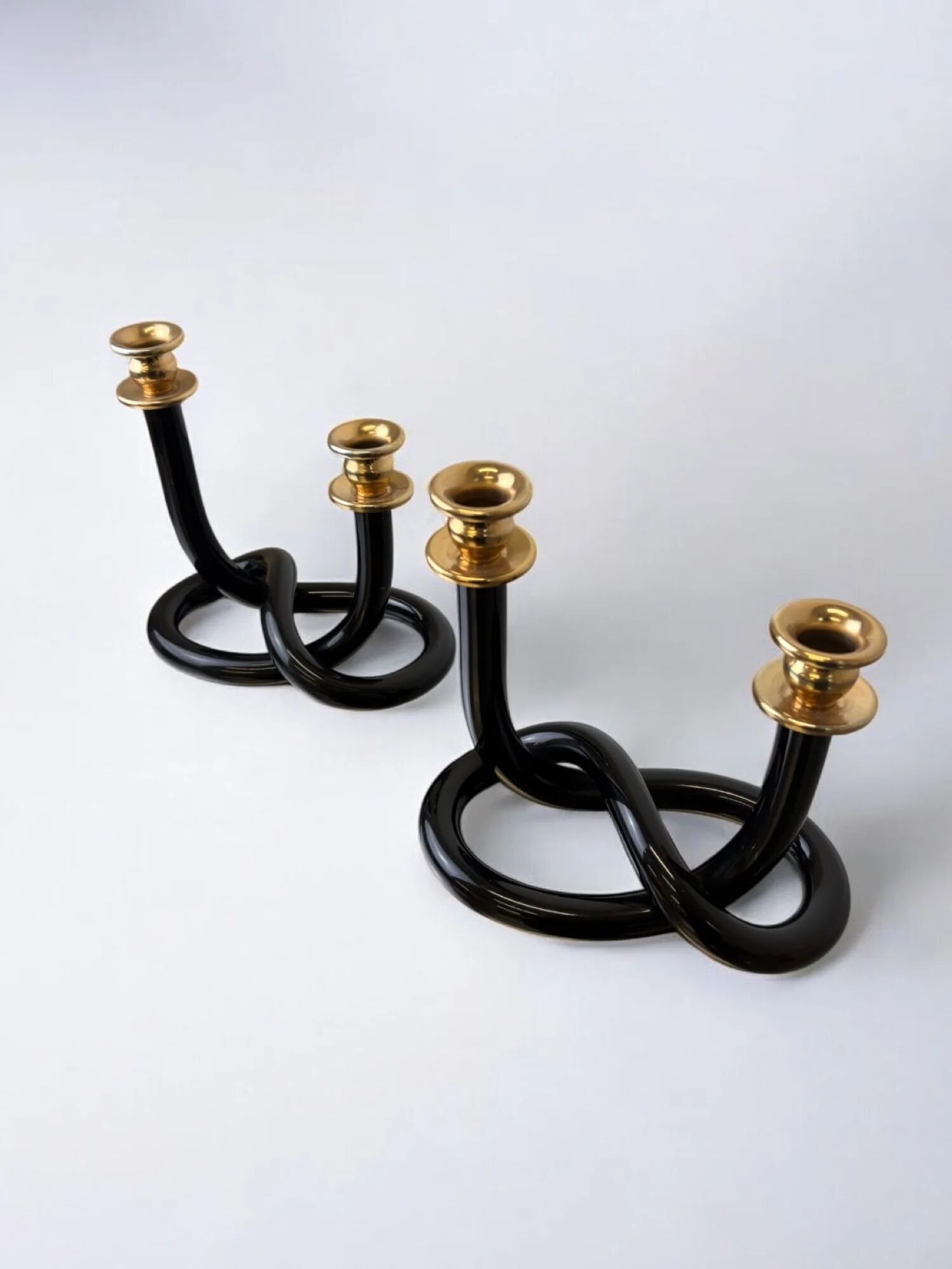 Pair of black pretzel candlesticks by Dorothy Thorpe, circa 1970s