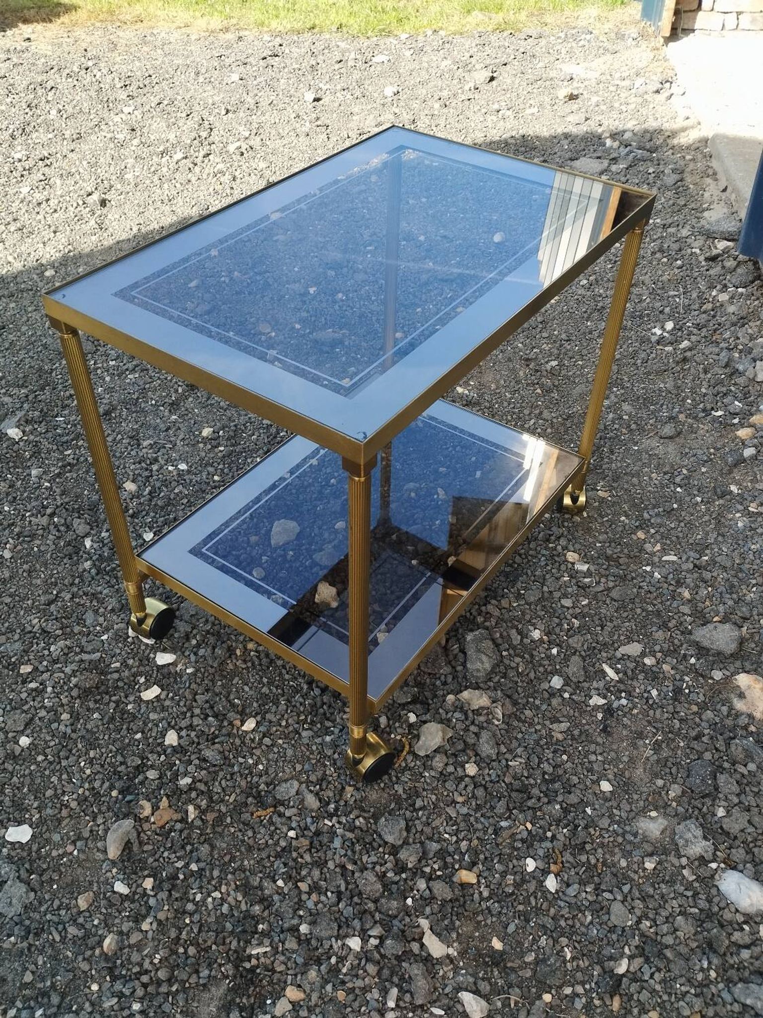 Vintage golden metal rolling dessert trolley