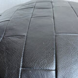Black patchwork leather pouf from Sède