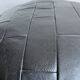 Pouf noir en cuir patchwork de Sède
