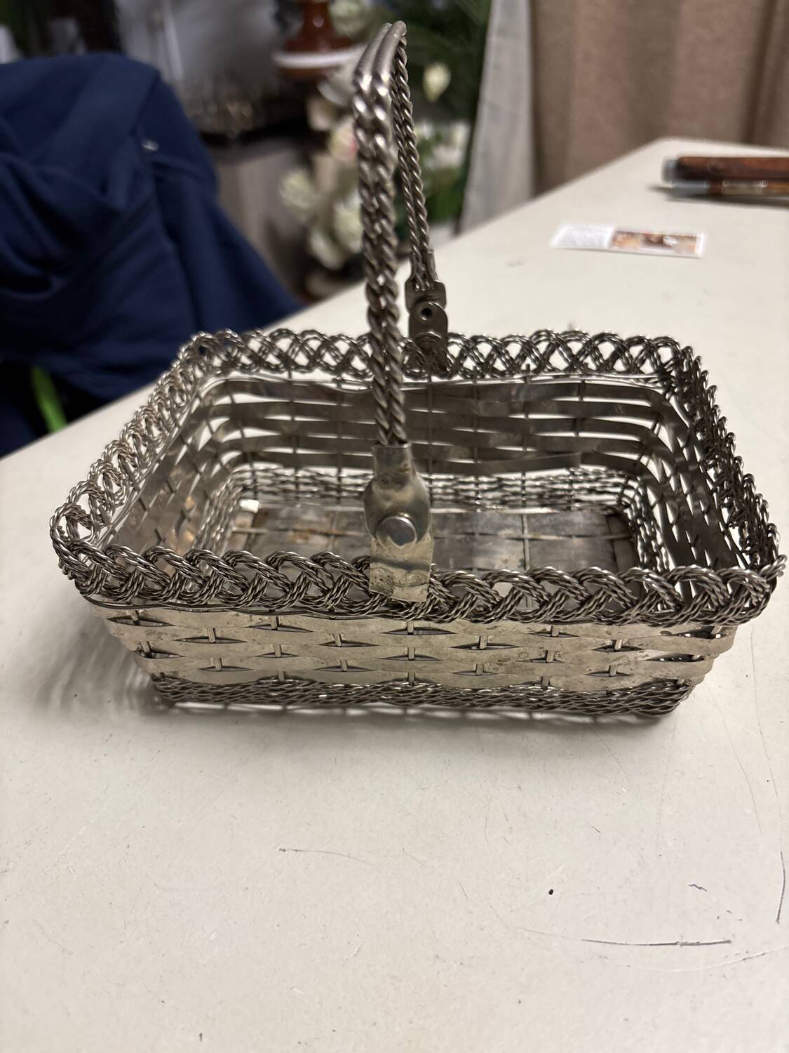 Antique woven metal basket