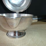 Covered saucepan with silver metal tail