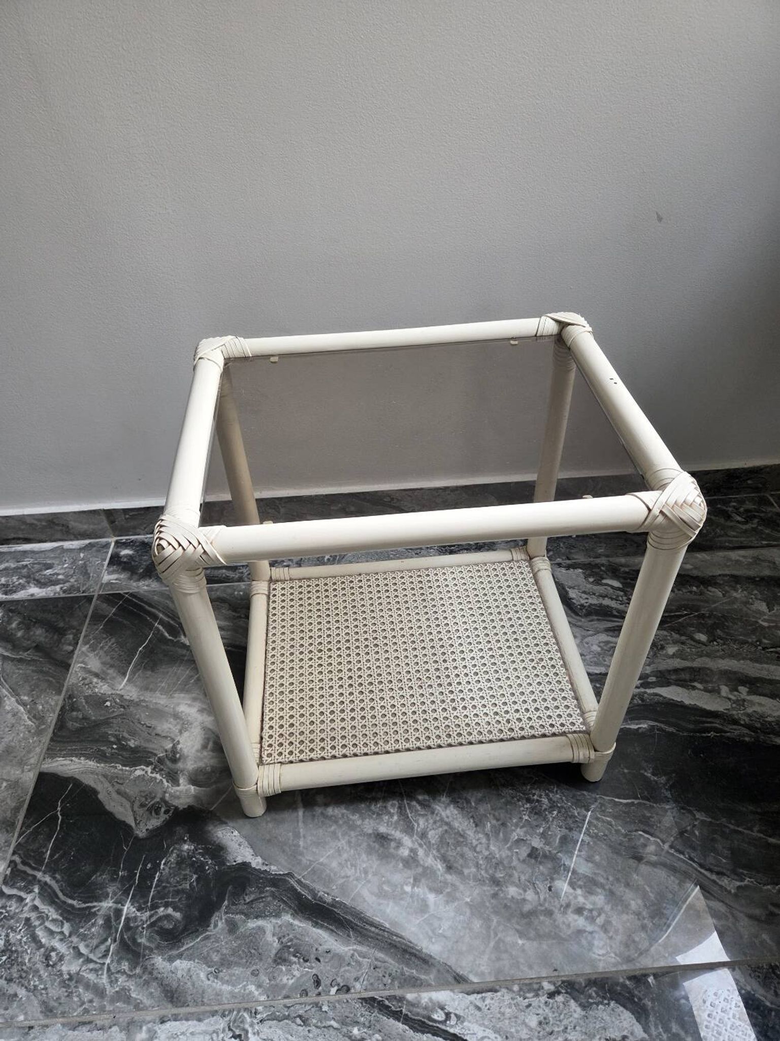 Rattan and cane side table with tinted glass top