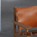 Pair of oak and leather hunting chairs by Kurt Østervig, modern Danish style from the 1960s.