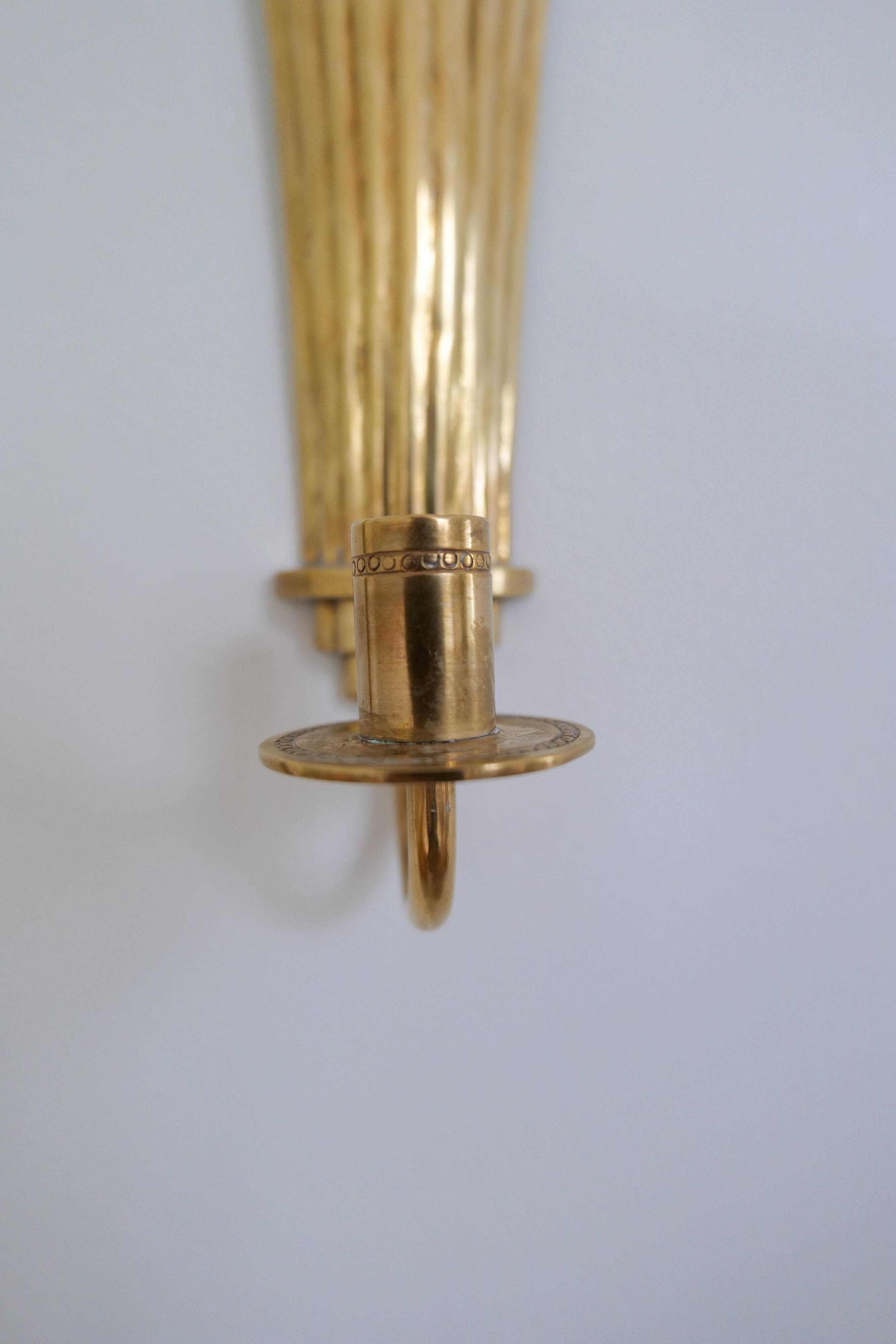 Pair of Art Deco brass wall sconces by Holmström, Arvika, Sweden, 1940s.