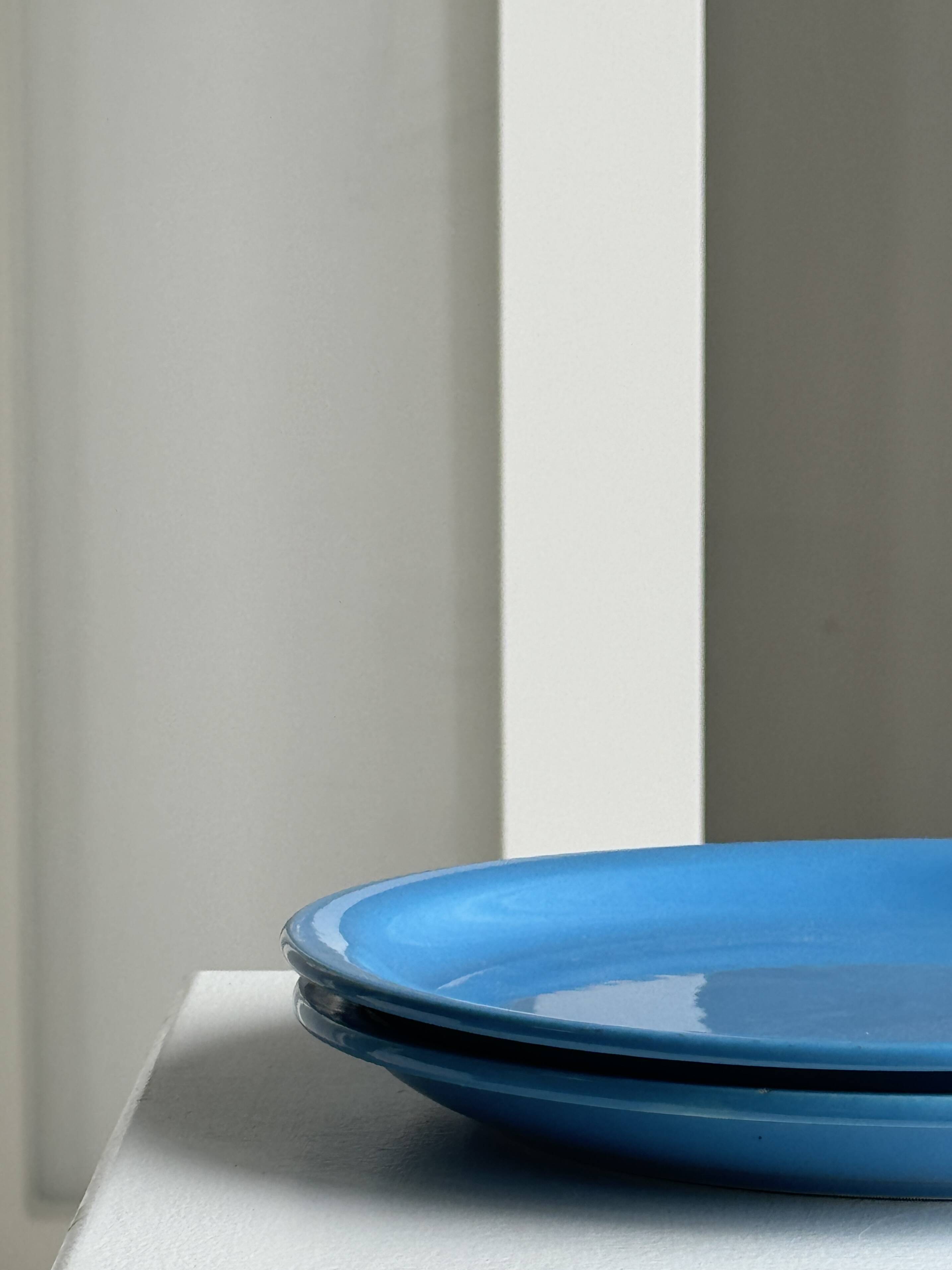 Set of 2 sky blue plates, one slotted