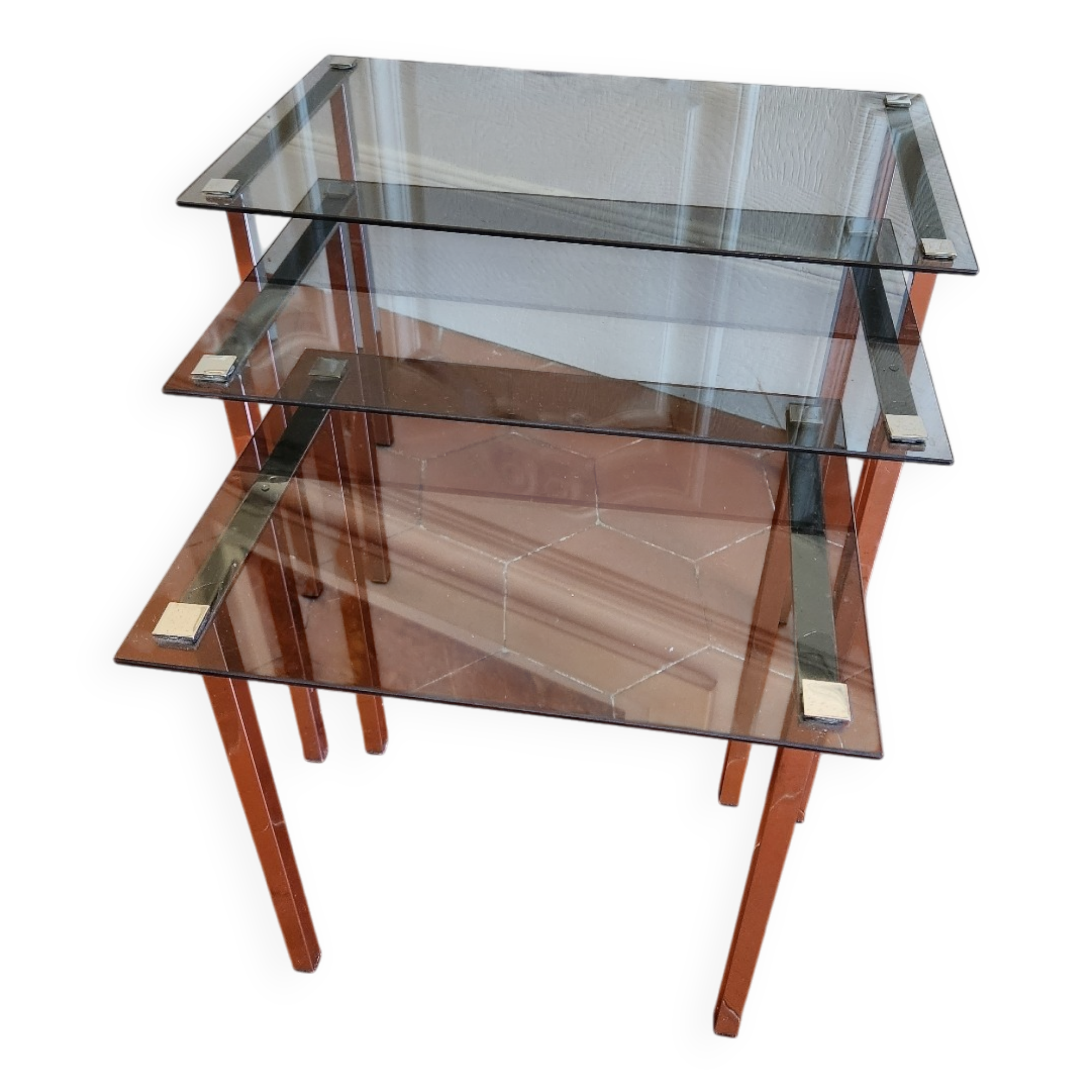 3 nesting tables from the 1970s in smoked glass.