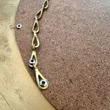 Old large golden sun mirror with rounded witch's eye in vintage resin from the 70s