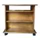 Louis Philippe style bookcase on wheels made of varnished solid wood.
