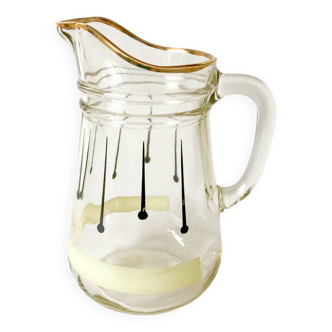 glass pitcher with black psyche patterns with gold edging from the 60s and 70s