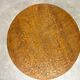 Round Art Nouveau coffee table with a sculpted top.