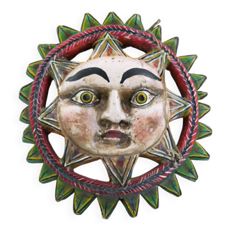 Vintage Mexican sun mask in hand-carved wood with brightly colored lacquer, traditional retro decorative wall art from South America
