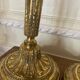 Pair of Louis XVI torch candlesticks in gilded bronze
