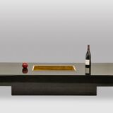 Willy Rizzo. Low table in black lacquered wood and gold brass. 1970s.