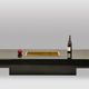 Willy Rizzo. Low table in black lacquered wood and gold brass. 1970s.
