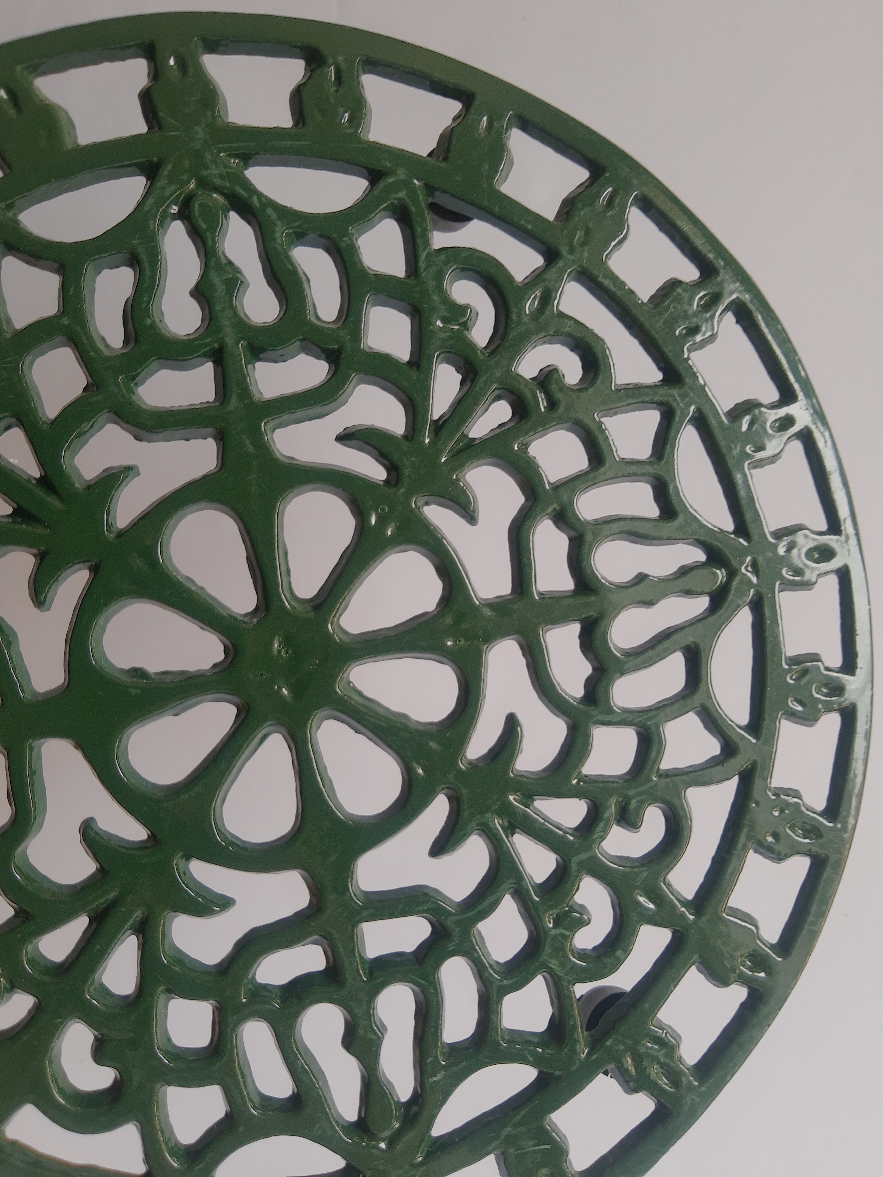 Vintage green cast iron trivet