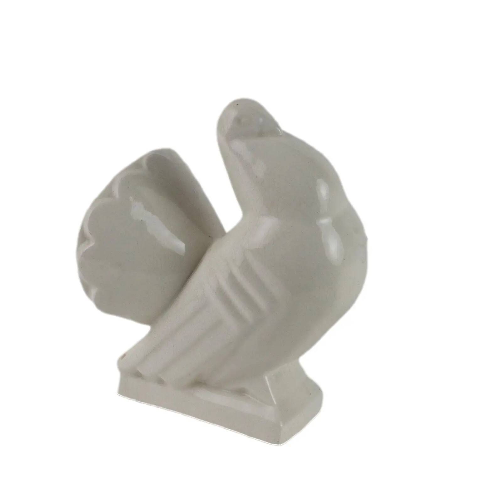 Ancient ceramic pigeon sculpture by George Ventrillon for Saint Clément.