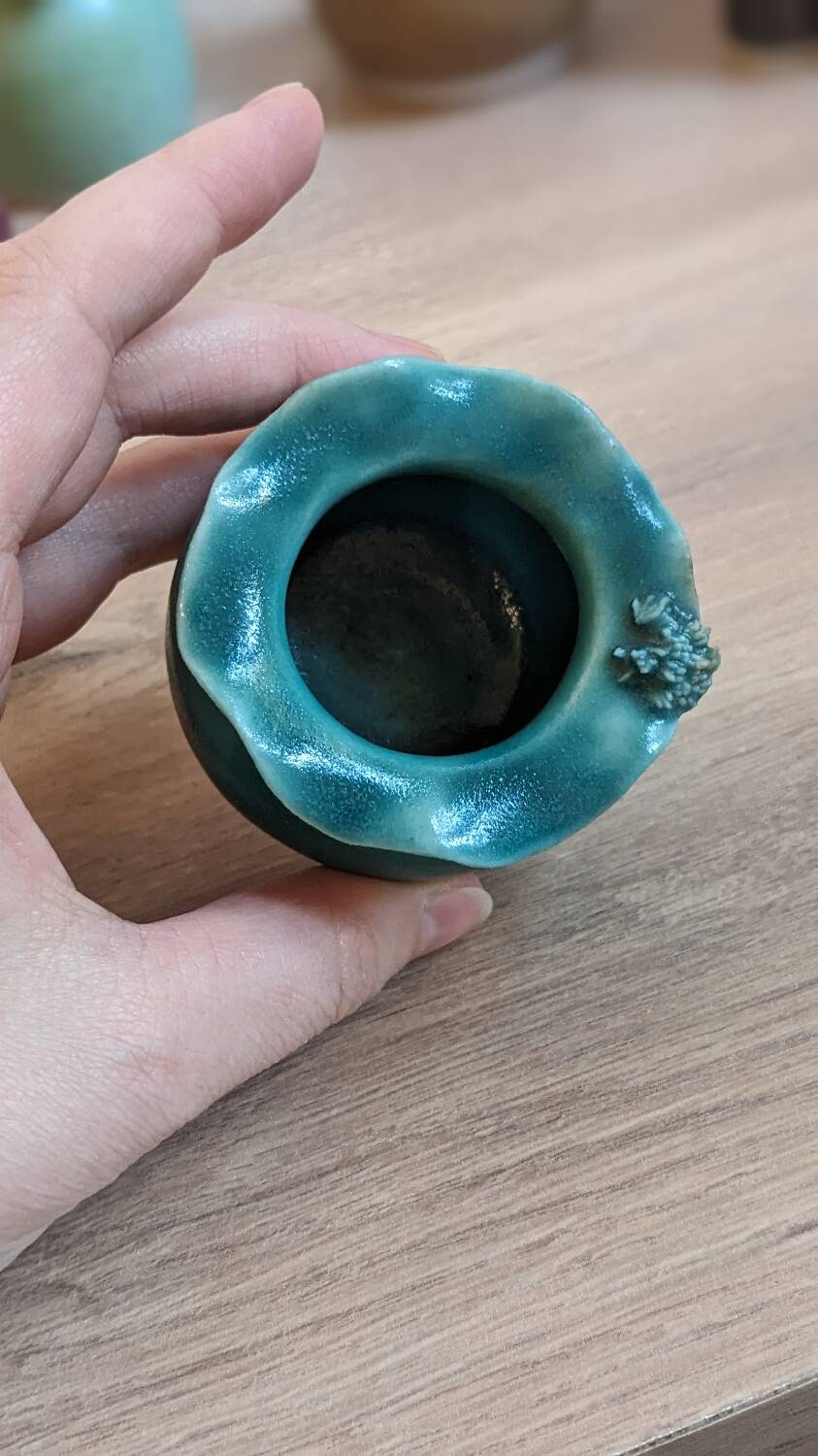Small handmade turquoise pottery.