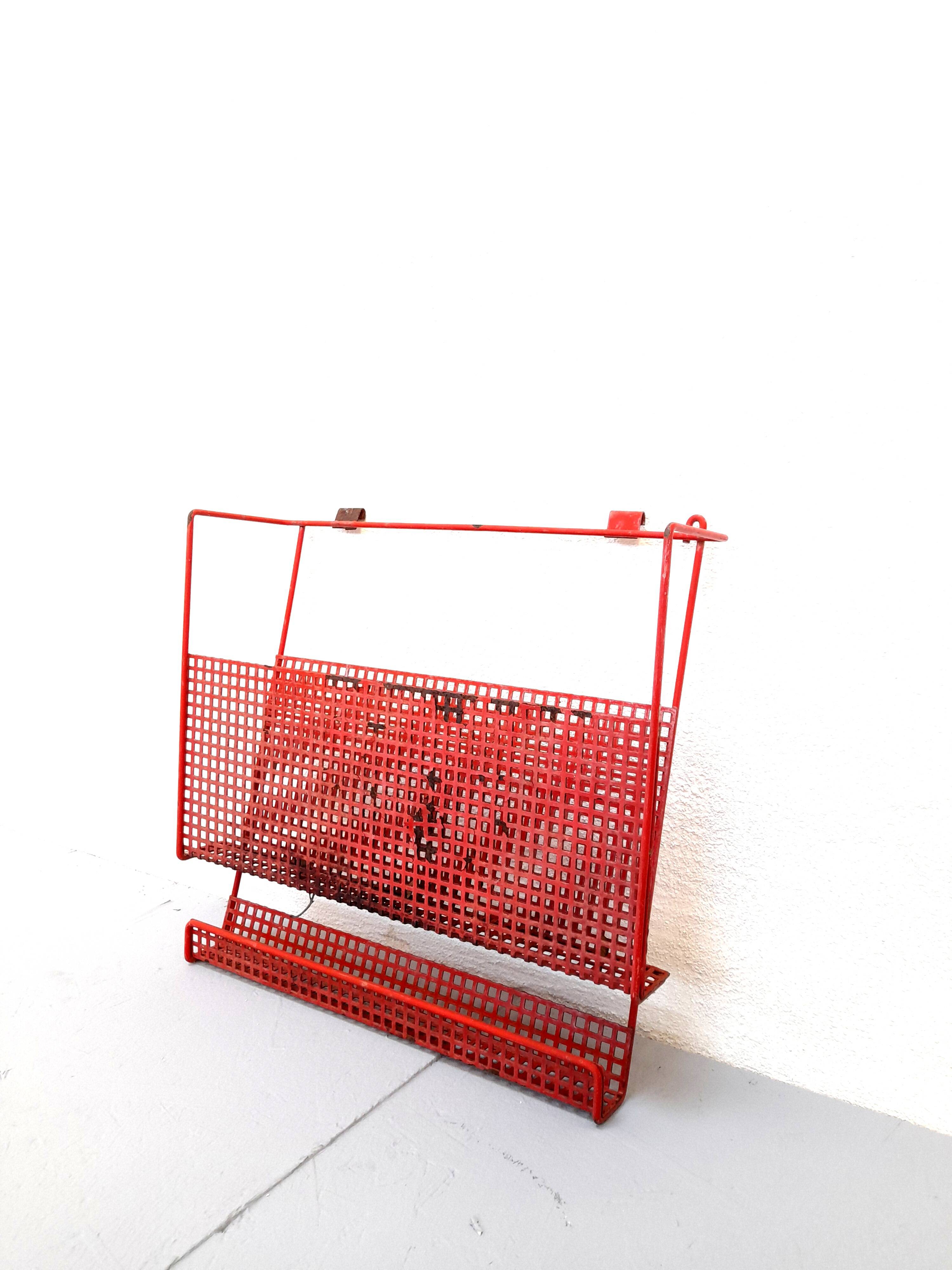 Vintage magazine rack in red lacquered perforated metal from the 70s