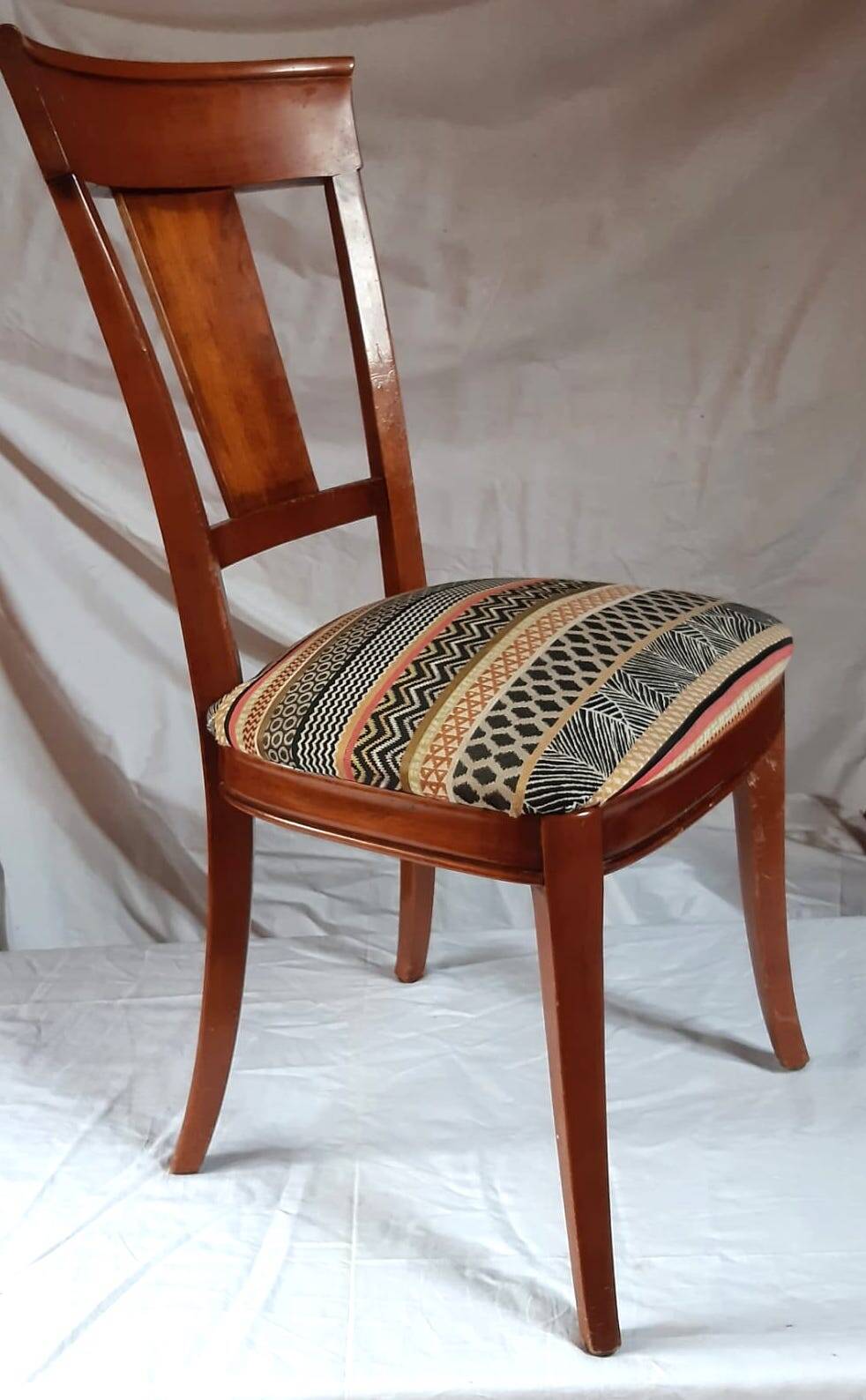 2 varnished solid wood chairs with "ethnic" padding