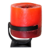 1970 wrought iron candlestick with its period coloured candle.