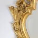 Regency style mirror in carved and gilded wood. 1950s.