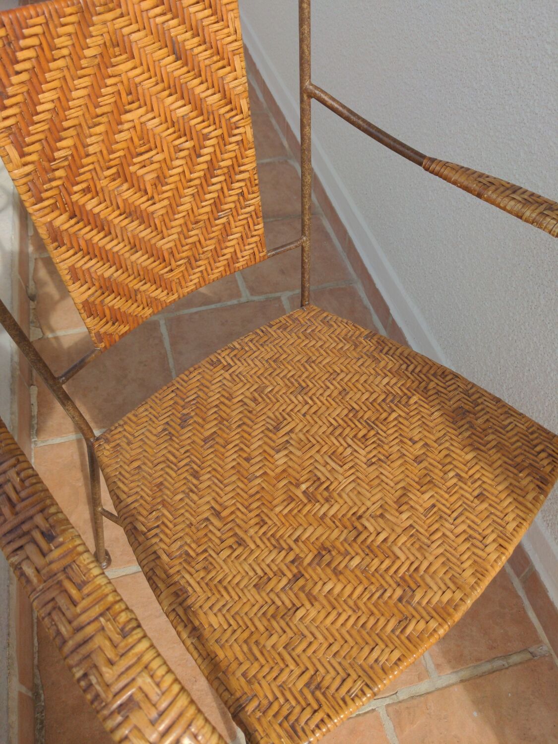 Wicker armchair and wrought iron