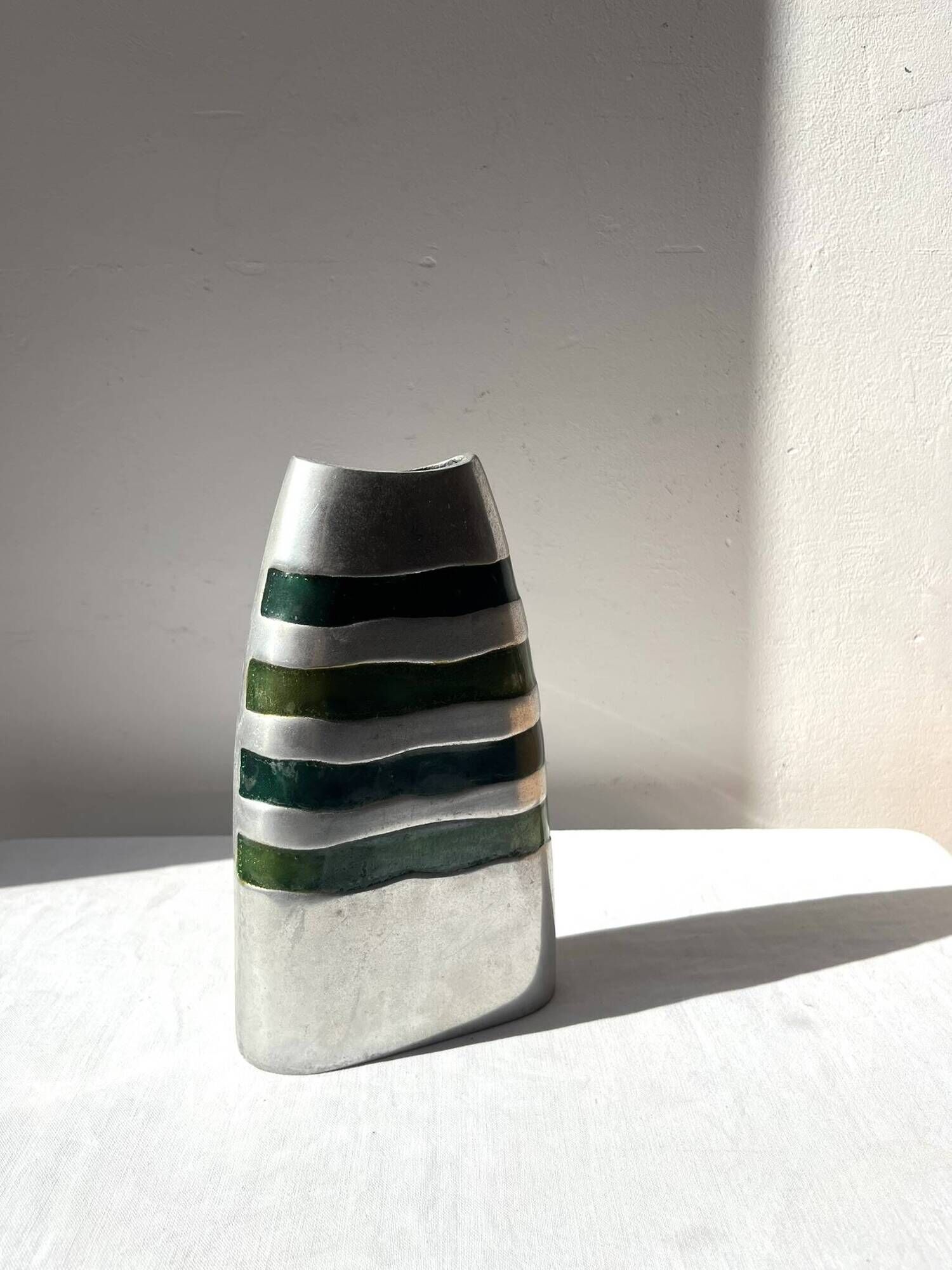 Vintage brushed aluminium vase with green stripes.