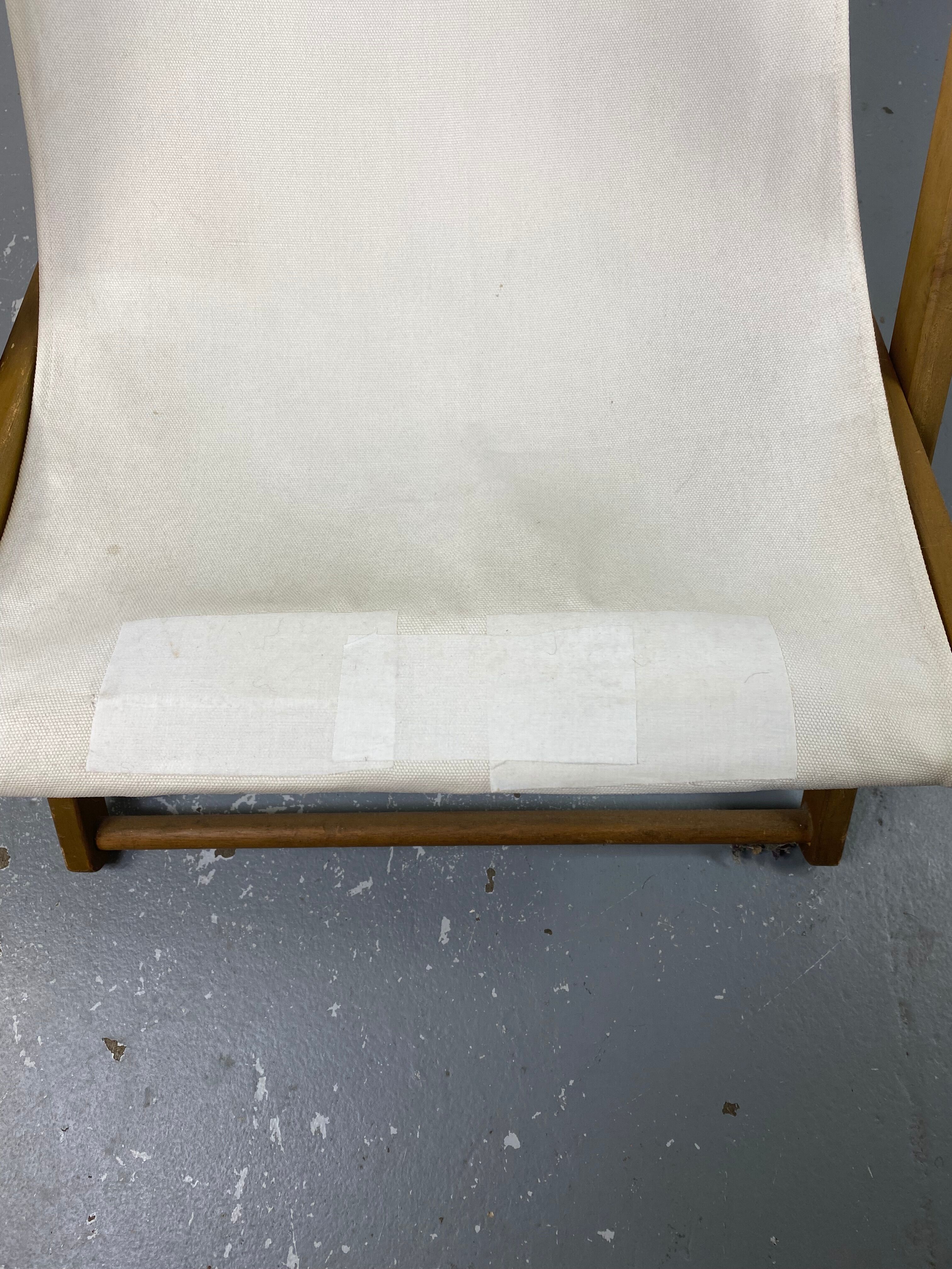 White fabric deckchair with wooden structure