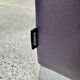 Pair of aubergine leather club armchairs by Cinna.