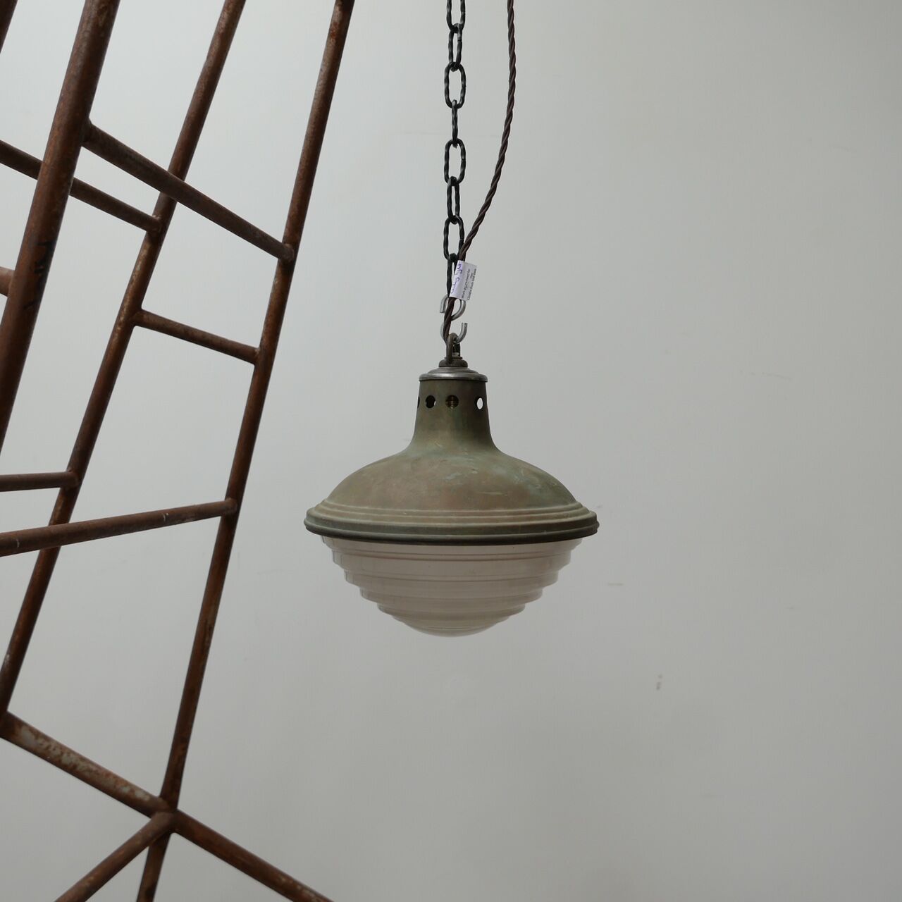 Patinated metal and glass Holophane pendant light