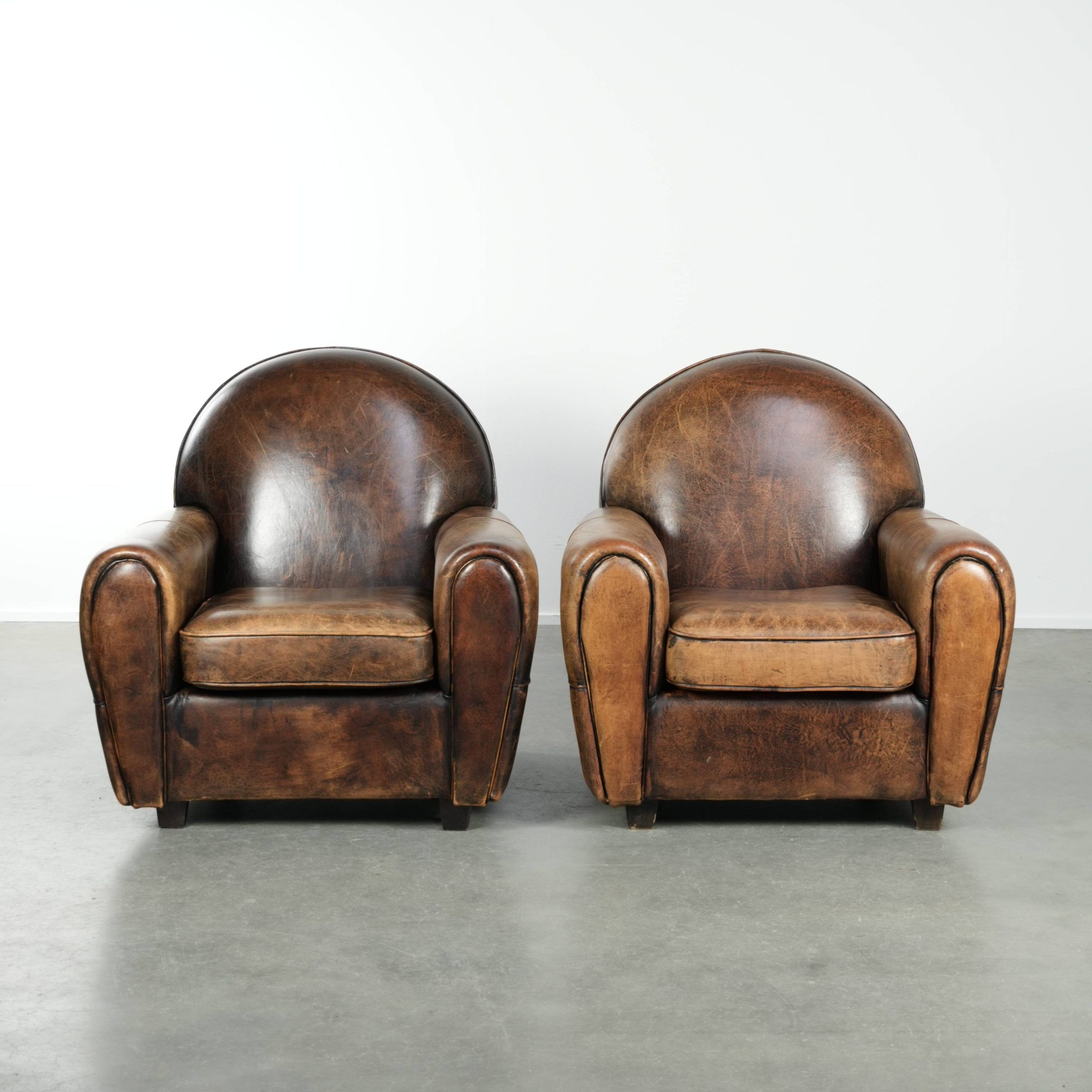 Set of two sheepskin Art Deco design armchairs with beautiful patina