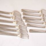 Silver plated metal service: 12 soup spoons, 12 forks and ladle.