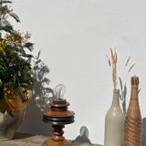 Foot of turned wooden lamp and carved