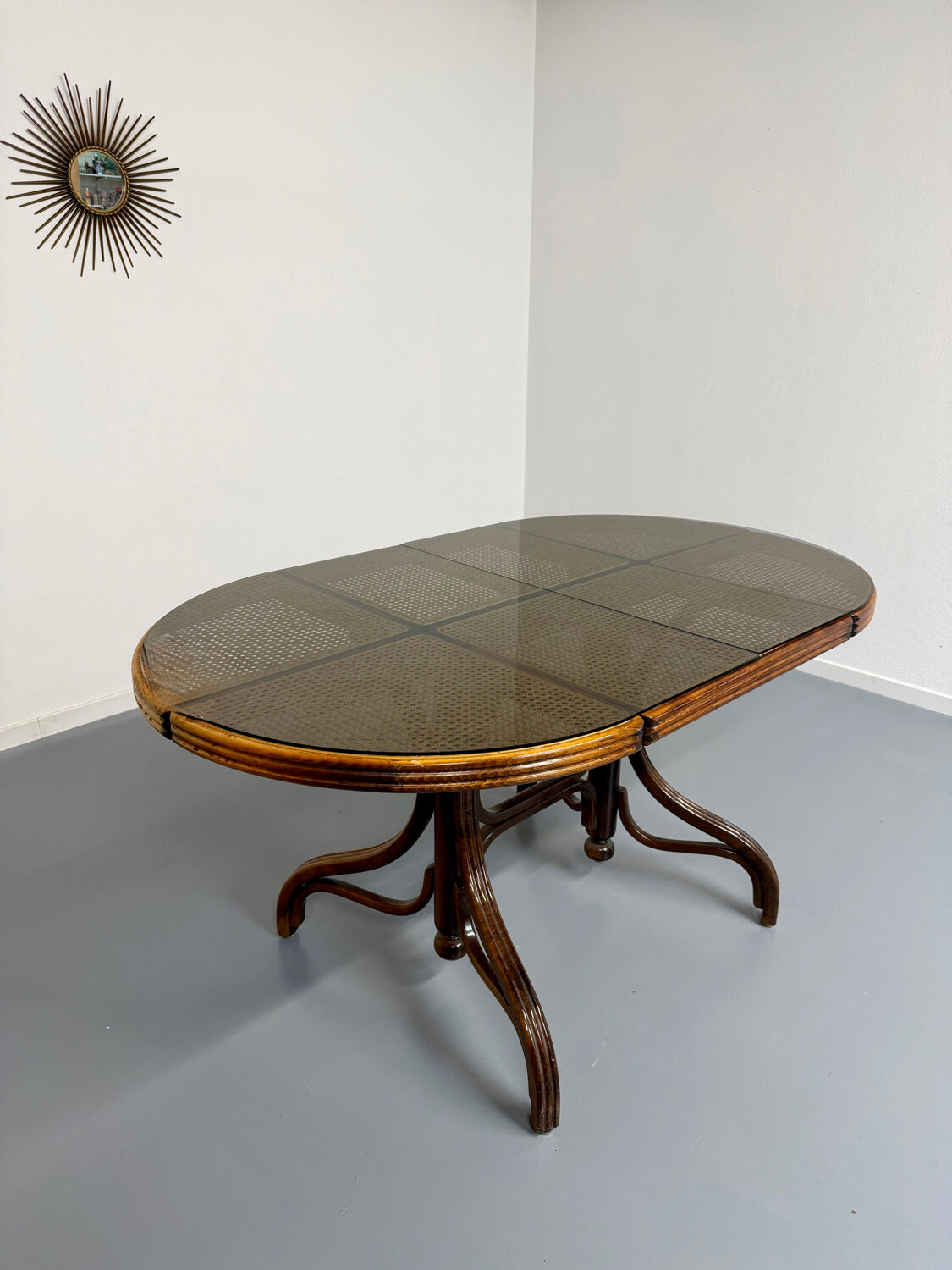 Vintage dining table with a cane top by Mundus from the 1970s.