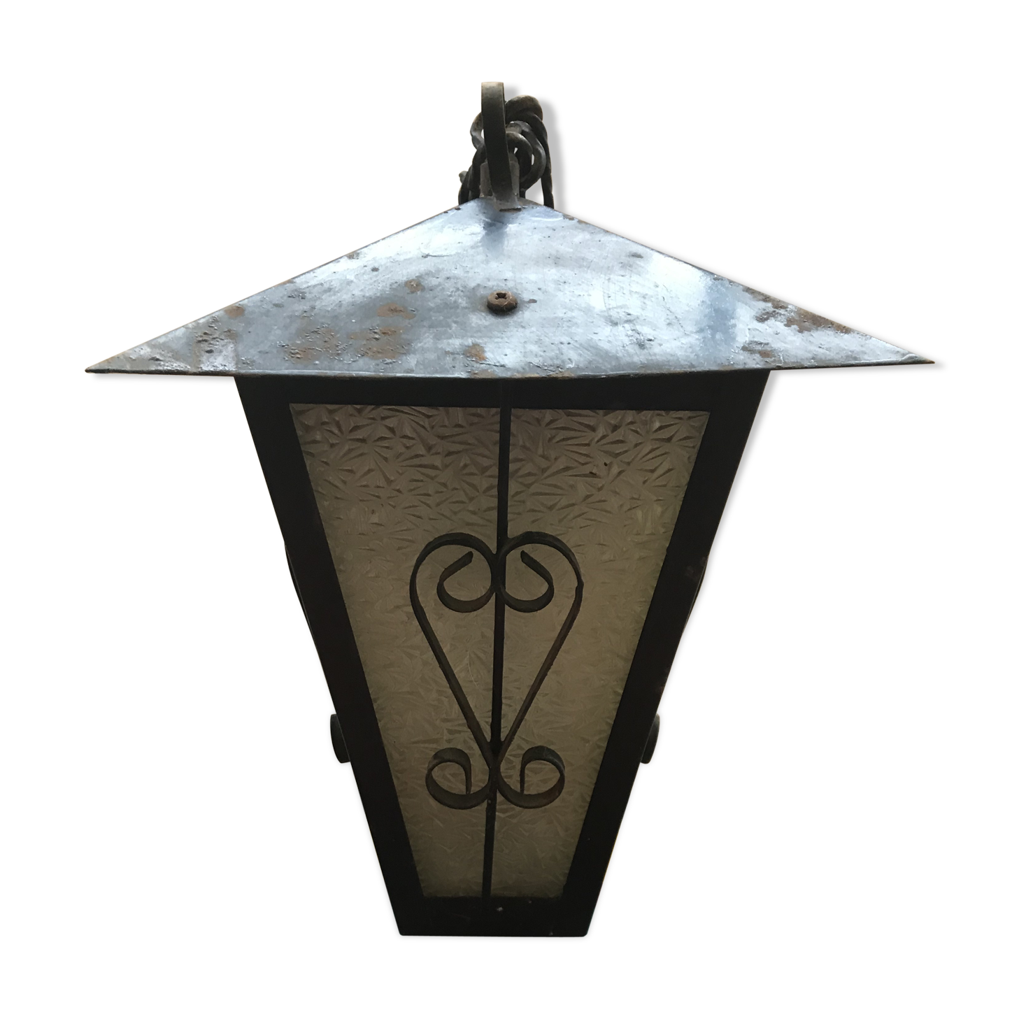 Old black forged iron suspension vintage in moulded glass