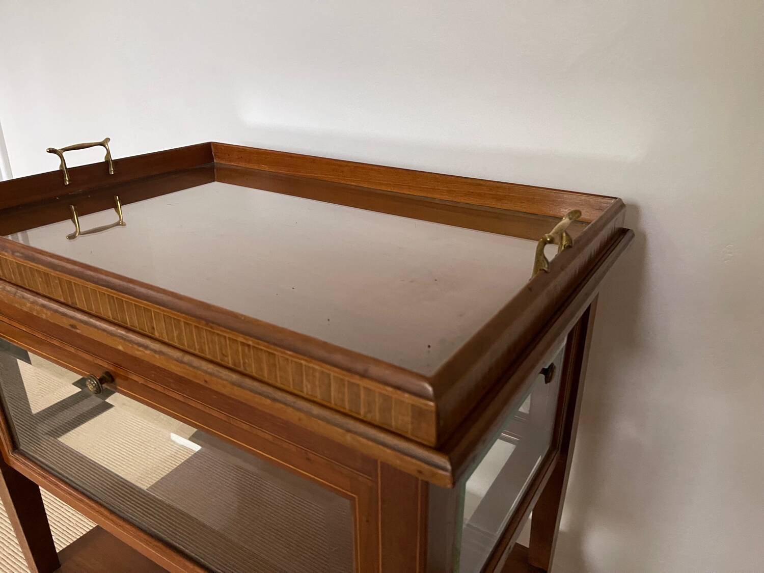 Serving Light mahogany English tea table. Beveled windows. circa 1900. Removable glass top.