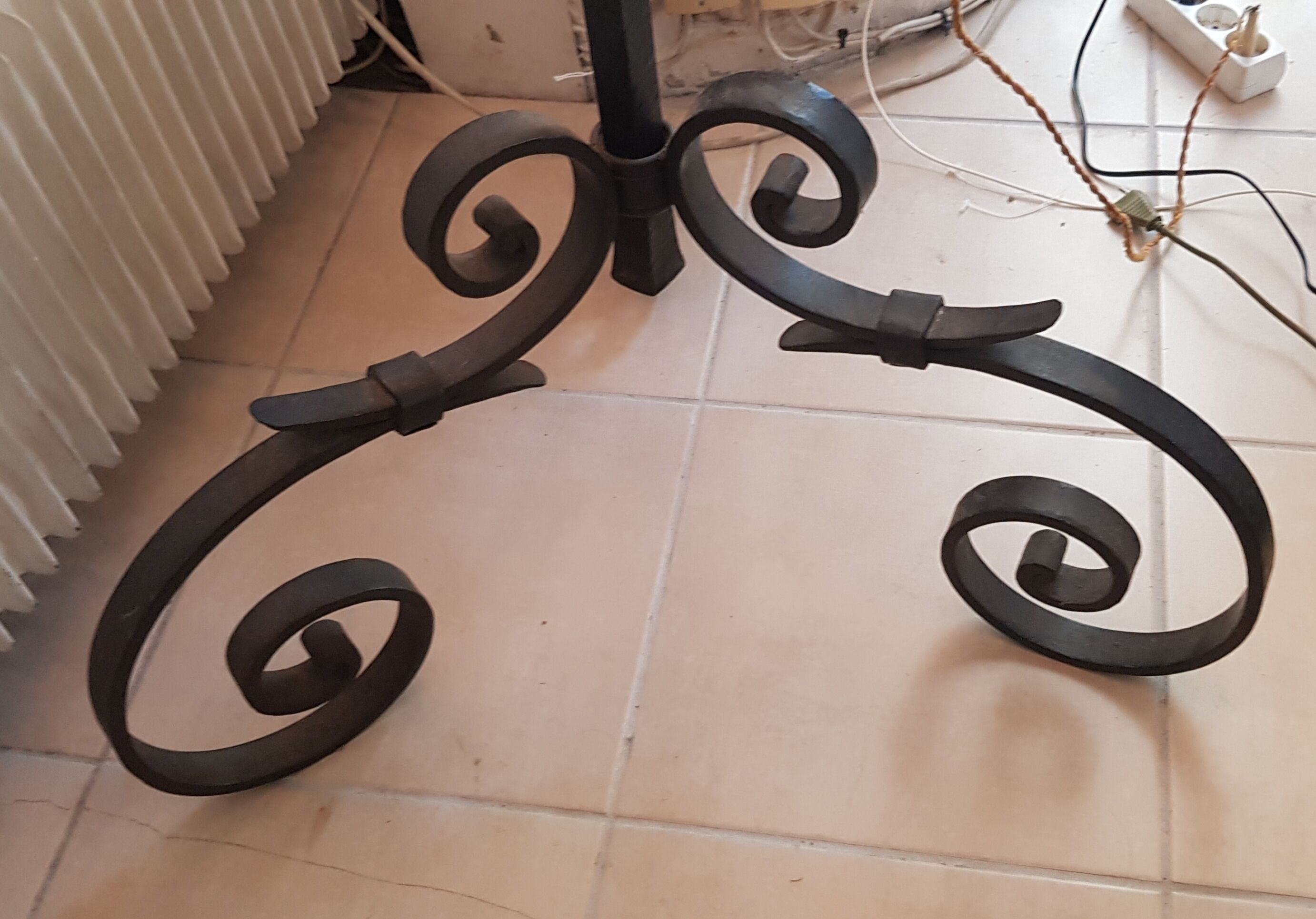 Old wrought iron tripod lamppost