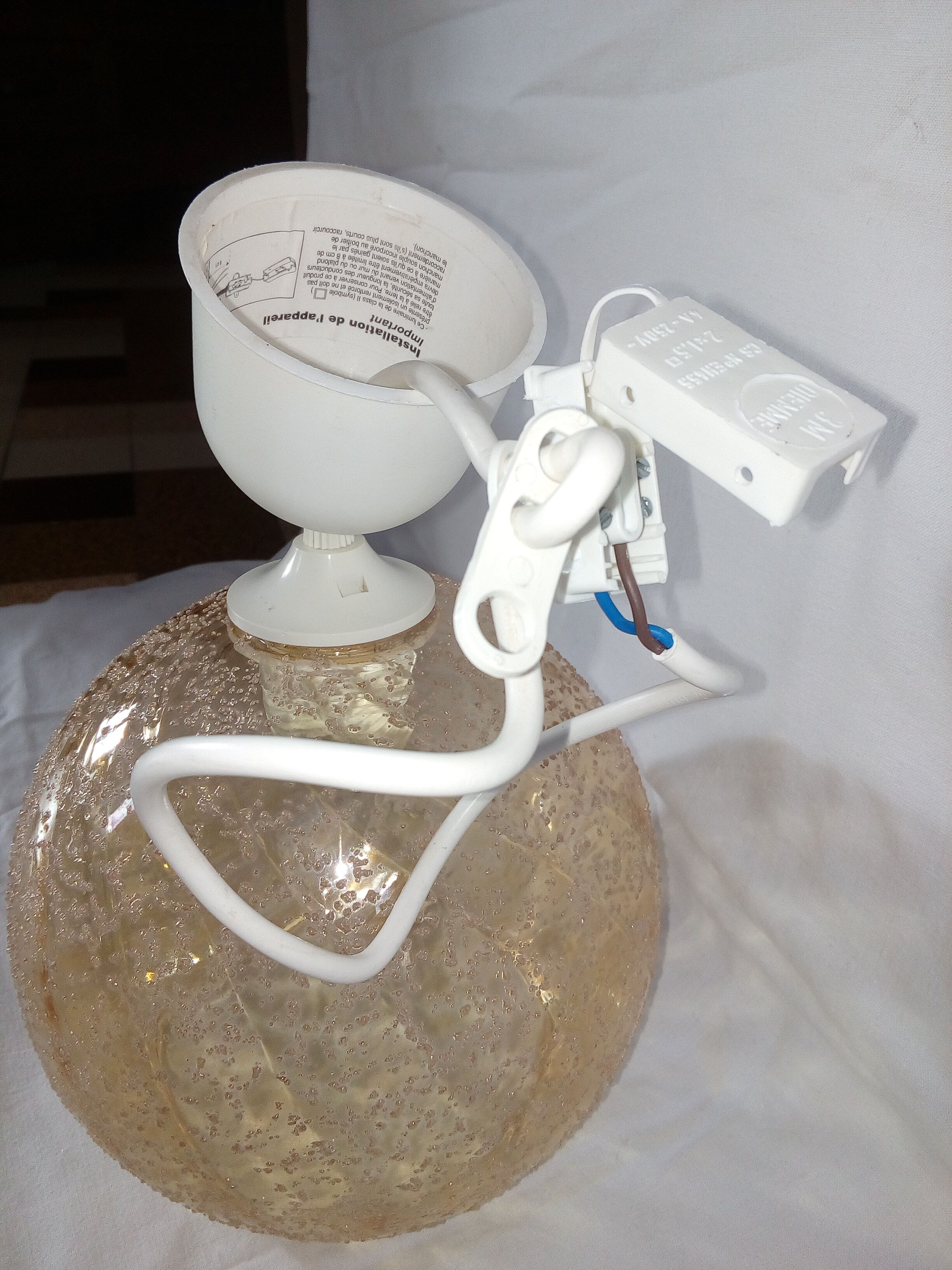 Hanging lamp globe ball in granular amber glass