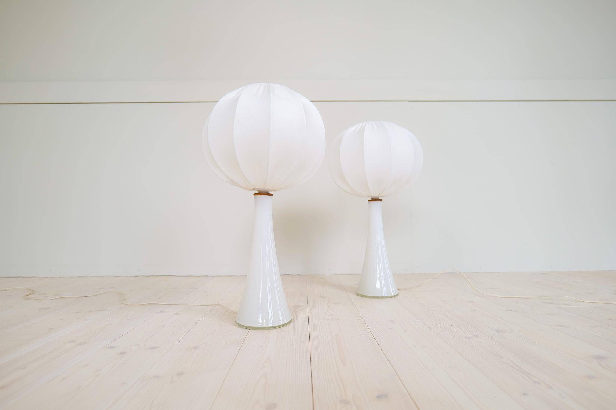 Pair of mid-century opaline glass table lamps with cotton shades by Bergboms, Sweden, 1960.