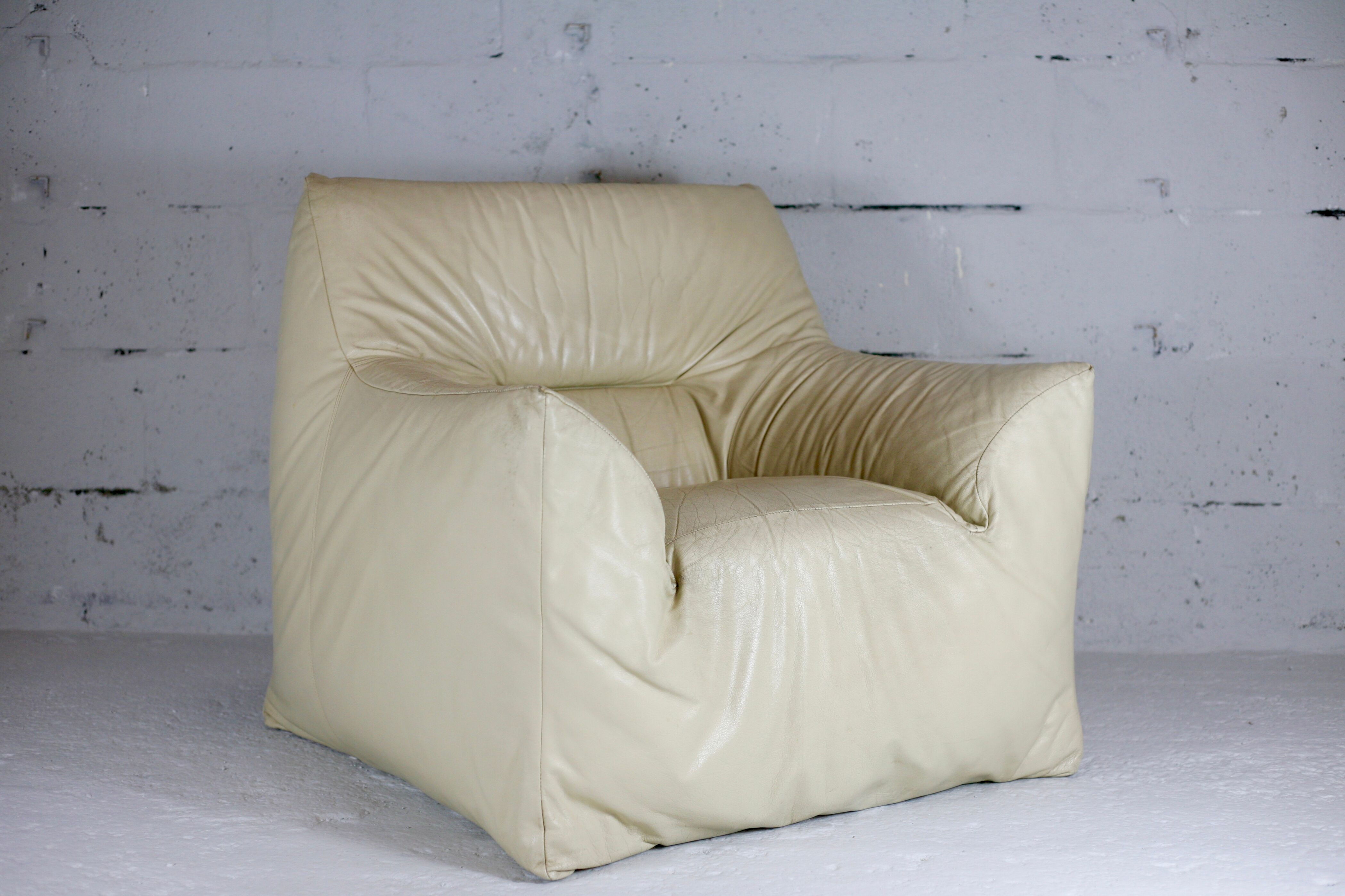 Leather armchair and cream-coloured foam, France , circa 1970