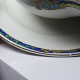 Old Lunéville sauce boat, opaque porcelain with polychrome decoration.