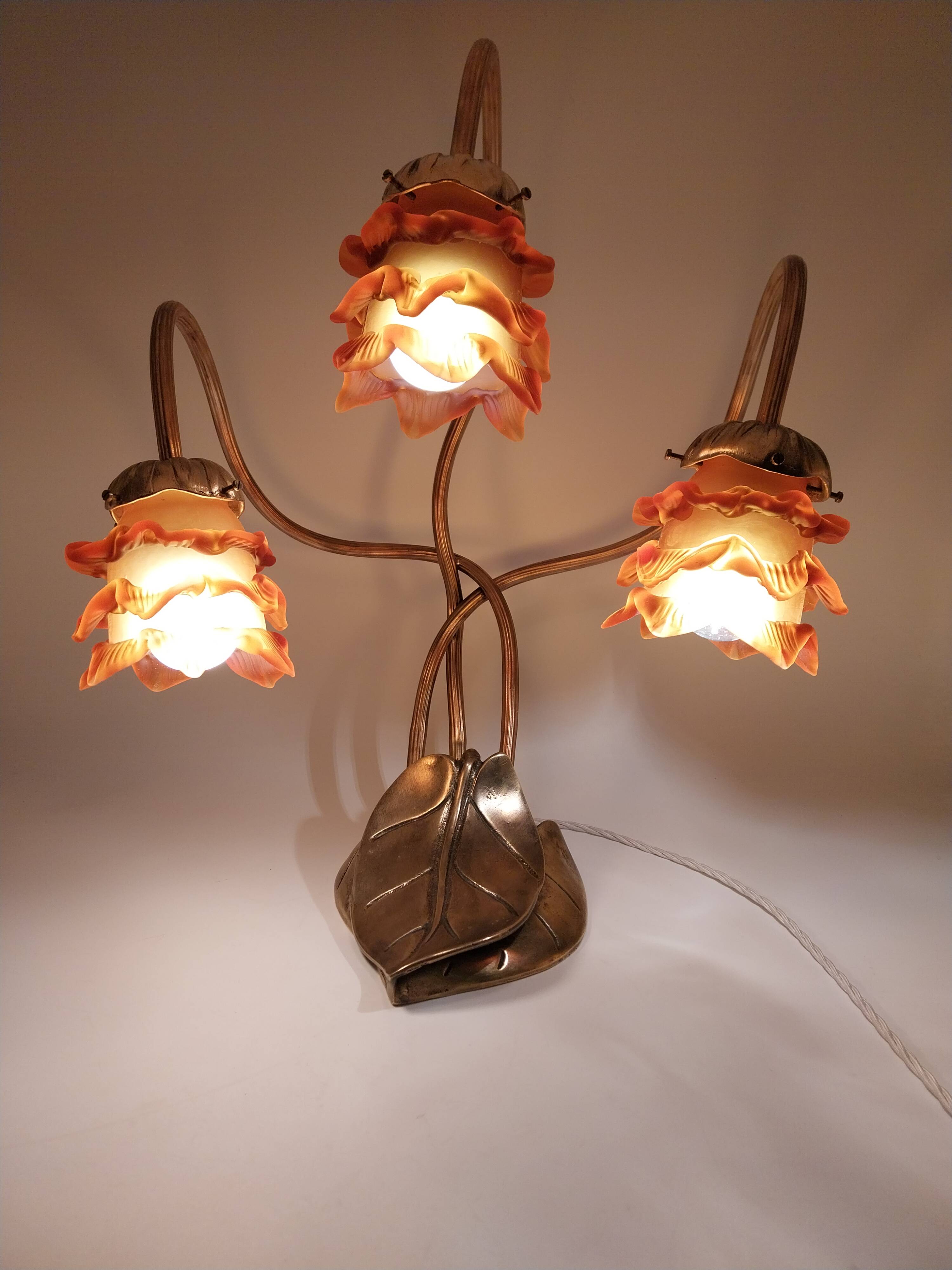 Lamp with brass leaves and glass paste flowers.