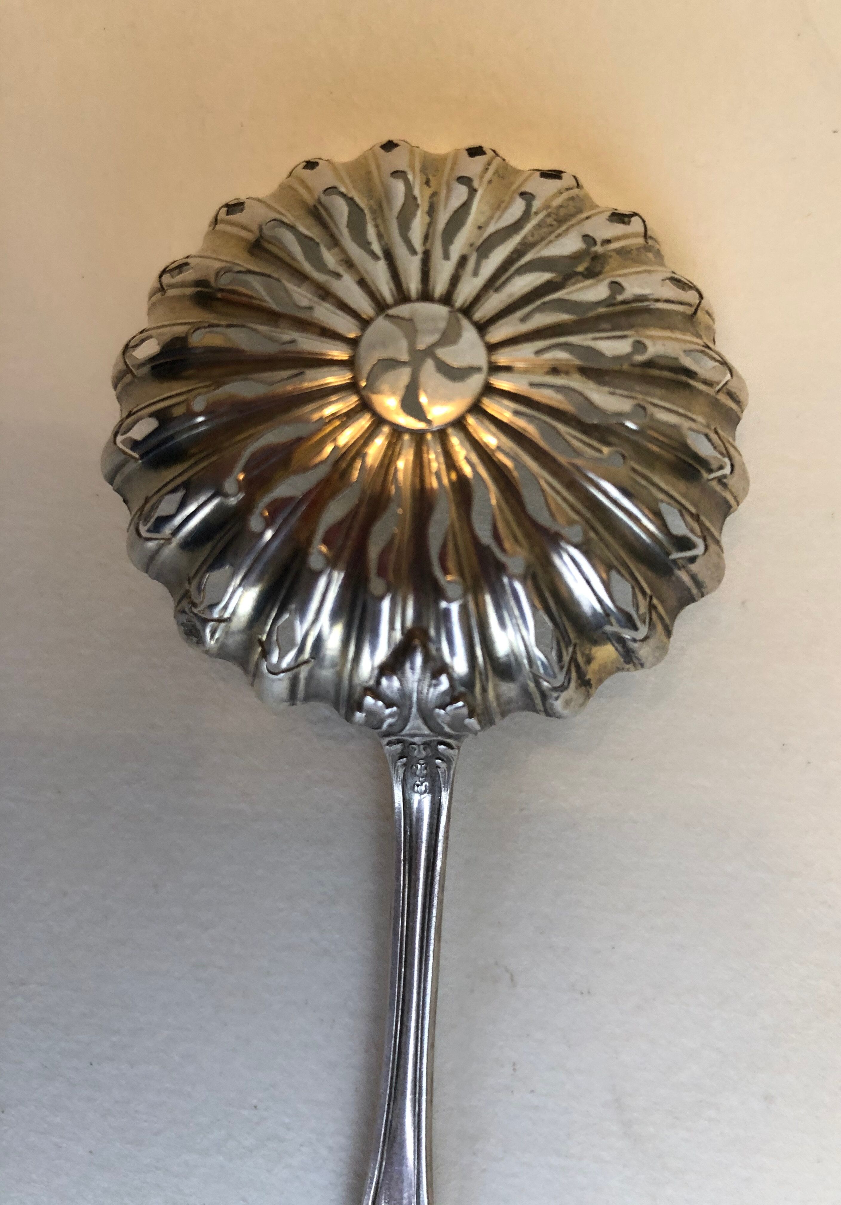 Silver sprinkler spoon